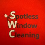 Red background with black and white text reading 'Spotless Window Cleaning' and a squeegee icon.
